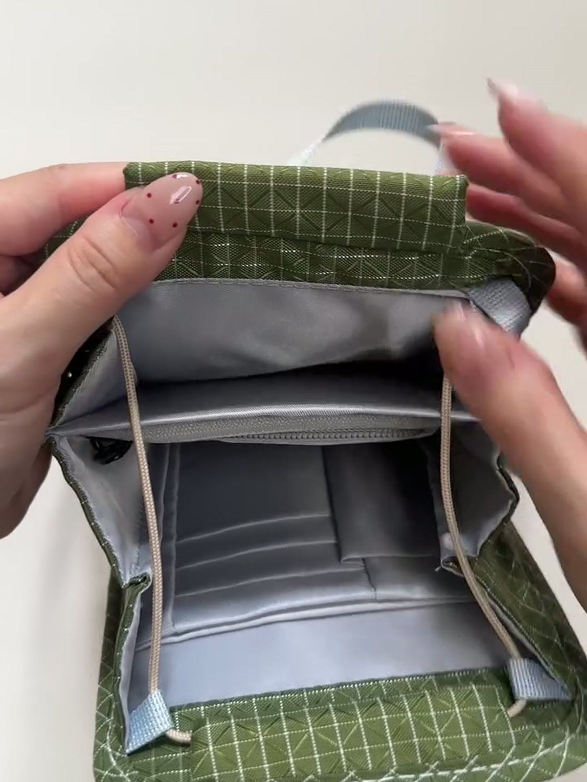 FURL Organizer Crossbody — open-flat, 3:4 still from the product video