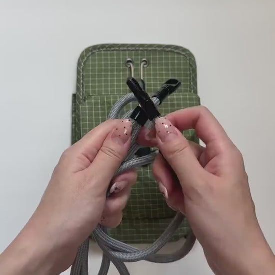 Organizer crossbody bag: the full packing demo — opens flat, loads up with a phone, e-reader, cards, coins and keys, then cinches shut